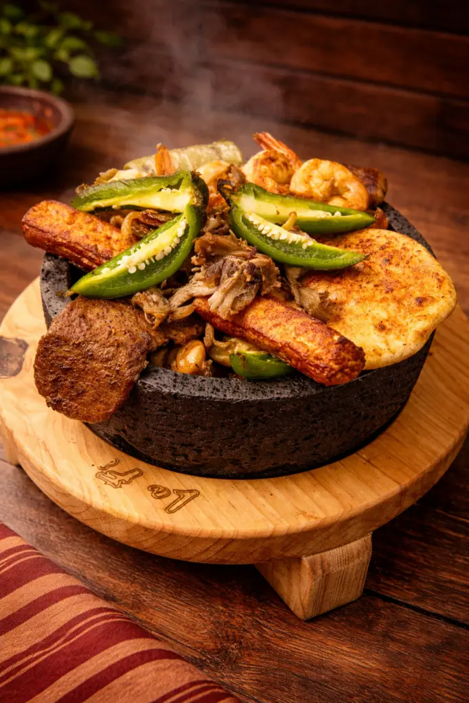 Mexican molcajete dish in Fort Myers La Fondita with grilled meats and shrimp