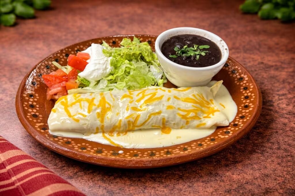Mexican enchiladas with green sauce and crema at La Fondita